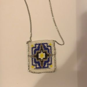 silver chain necklace with intricate bead design